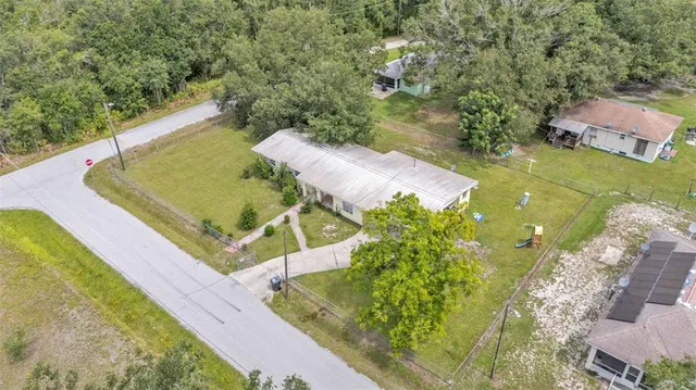 a view of a pool and an outdoor space