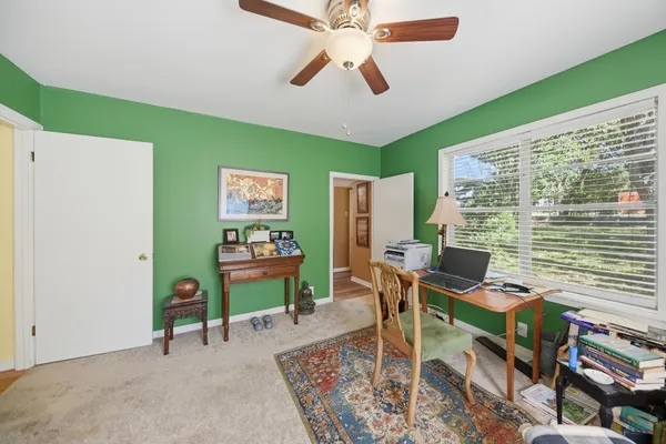 a workspace with furniture and a window