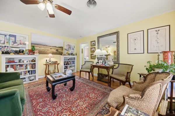 a living room with furniture and a rug