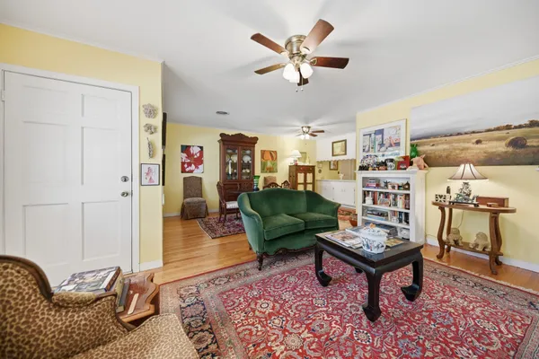 a living room with furniture and a rug