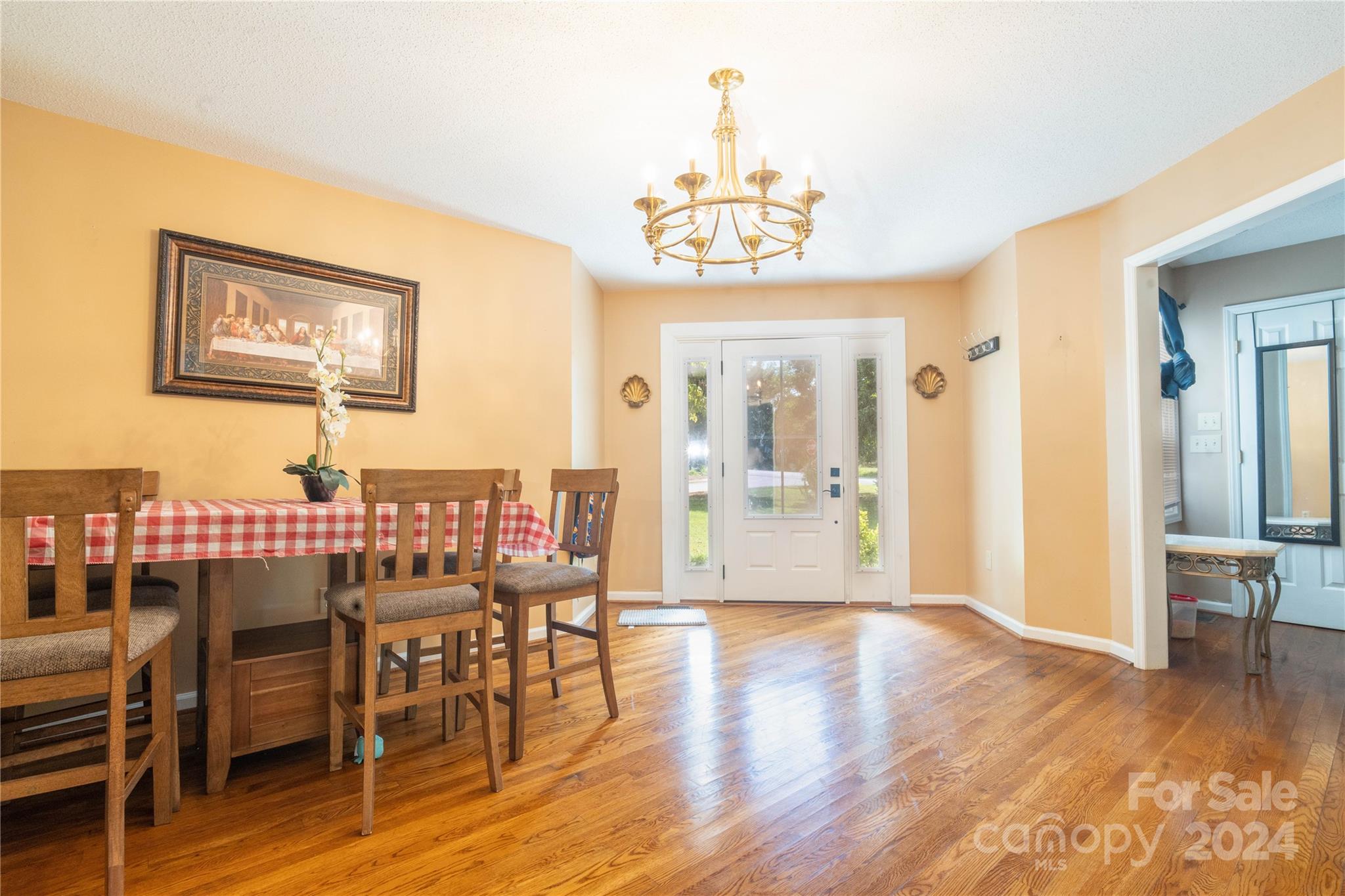 4710 Bert Huffman Drive Granite Falls, NC 28630 - Photo 5 of 28 a view of a dining room with furniture and wooden floor