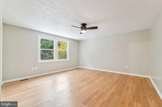 a bathroom with a sink toilet and a mirror