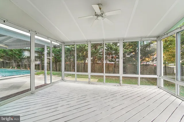 a view of a backyard with a tree