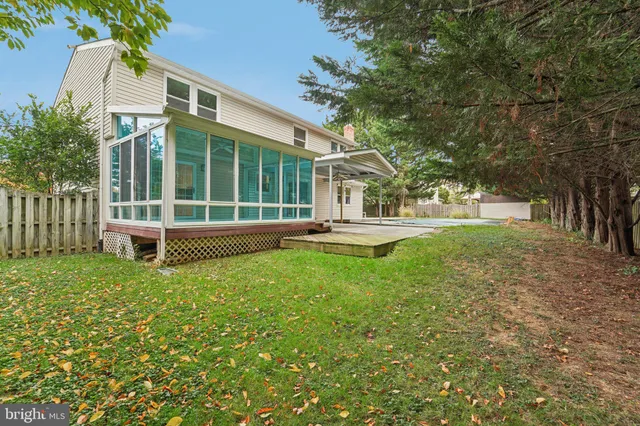 an aerial view of a house with swimming pool garden and mountain view in back