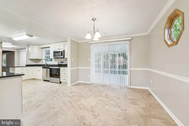 a view of a kitchen with a sink cabinets and a window