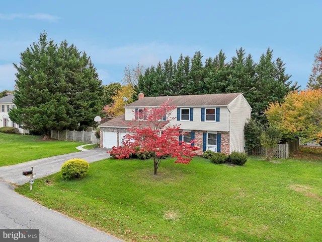 an aerial view of a houses with yard