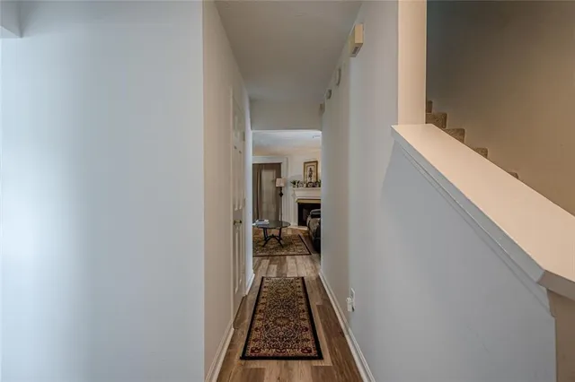 a view of hallway with wooden floor