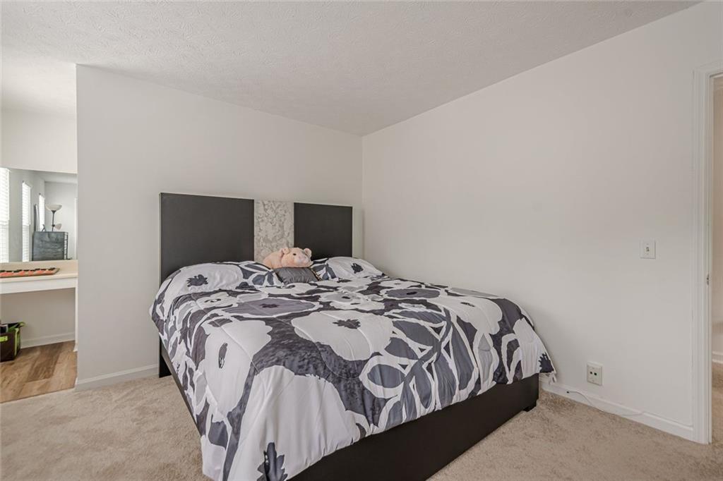 3403 Spring Harbour Drive Doraville, GA 30340 - Photo 13 of 27 a bedroom with a bed and window