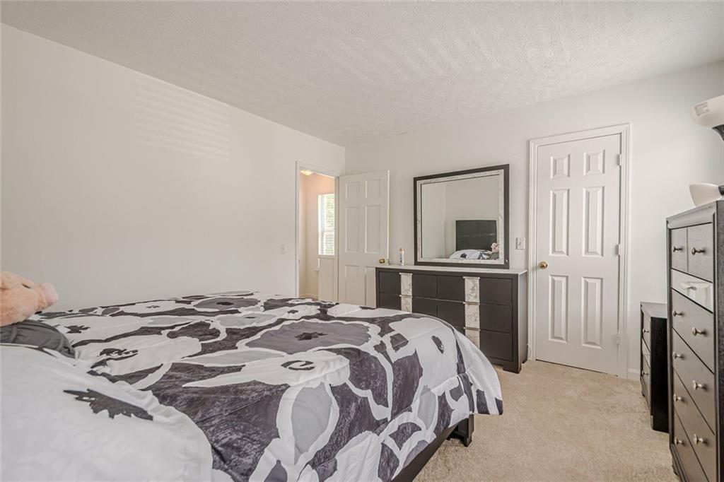 3403 Spring Harbour Drive Doraville, GA 30340 - Photo 14 of 27 a bedroom with a bed and a television