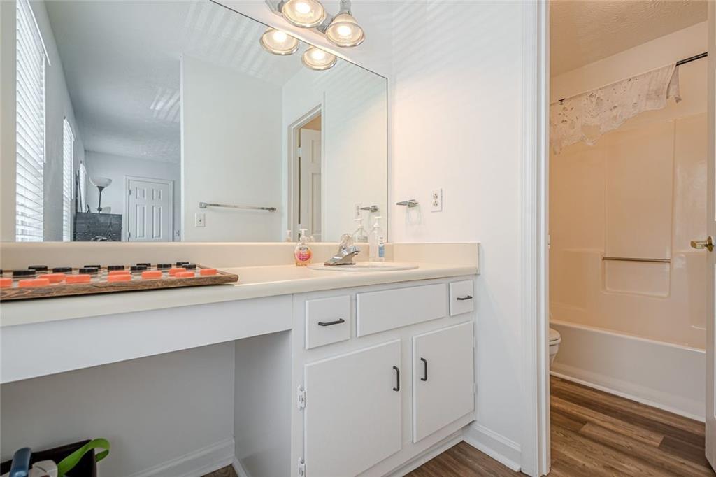 3403 Spring Harbour Drive Doraville, GA 30340 - Photo 15 of 27 a bathroom with a double vanity sink mirror and shower