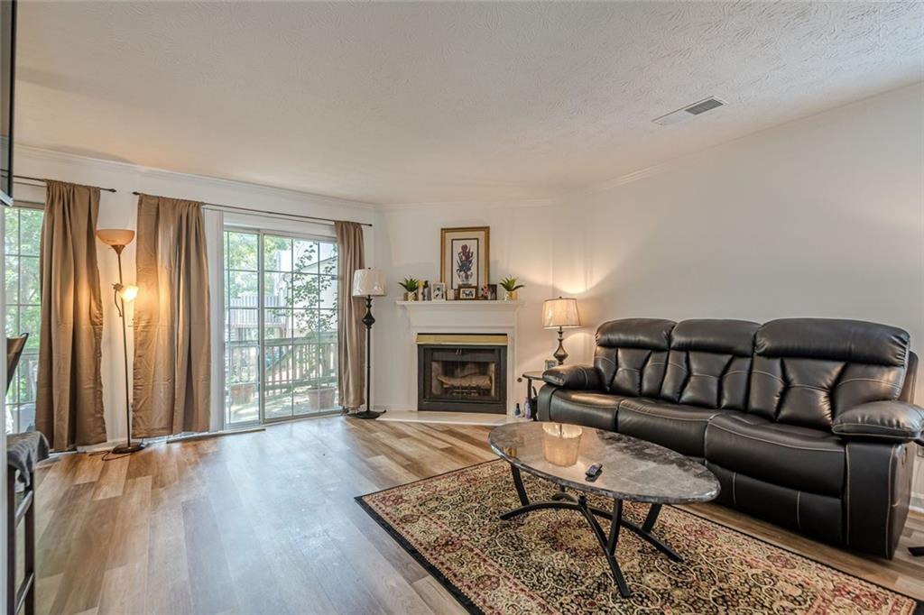 3403 Spring Harbour Drive Doraville, GA 30340 - Photo 2 of 27 a living room with furniture and a fireplace