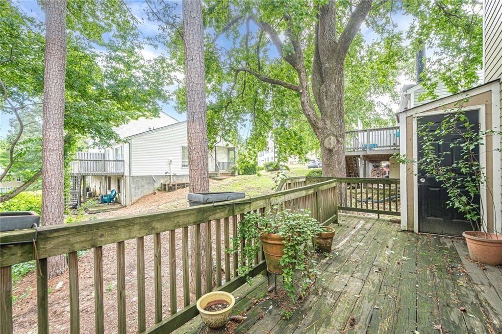 3403 Spring Harbour Drive Doraville, GA 30340 - Photo 21 of 27 a view of a house with a small yard and large trees