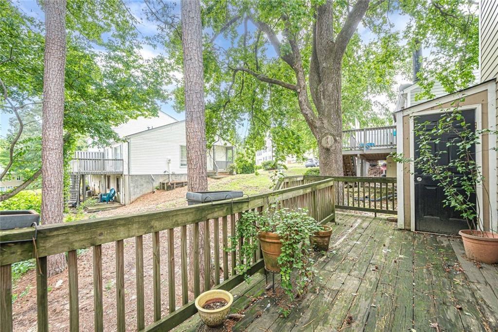 3403 Spring Harbour Drive Doraville, GA 30340 - Photo 21 of 27 a view of a house with a small yard and large trees