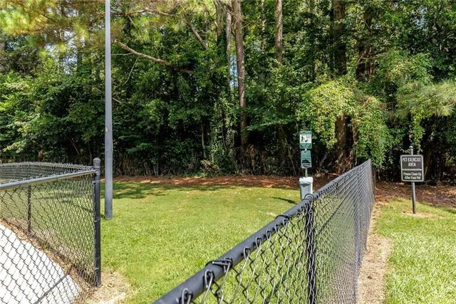 a view of a balcony with yard