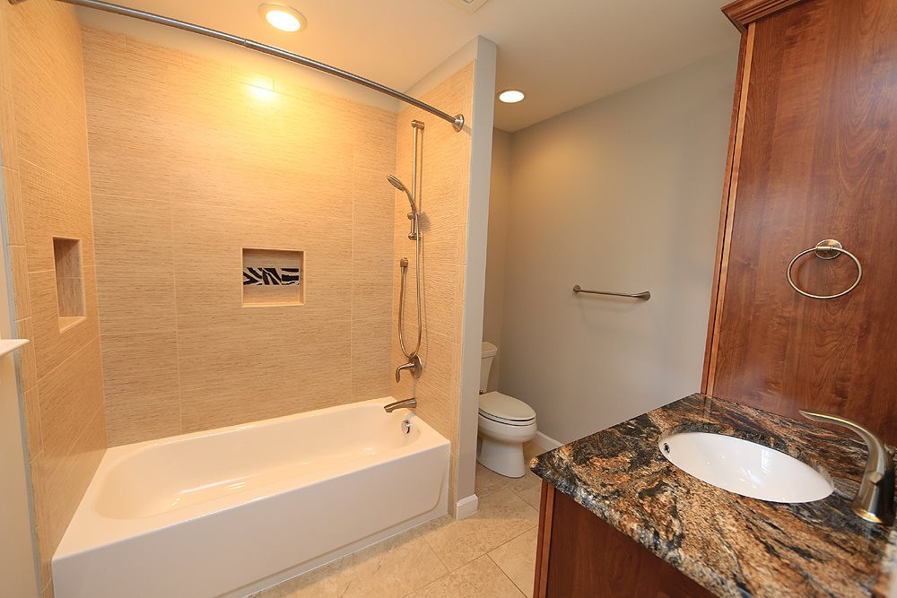 4005 Picardy Drive Raleigh, NC 27612 - Photo 6 of 19 Who wouldn't love a private bath like this? Bedroom 2 has a newly updated bathroom with Granite top Vanity, Linen Closet, Tile Floor, and Tile Tub/Shower Surround. Very nice! Bathroom