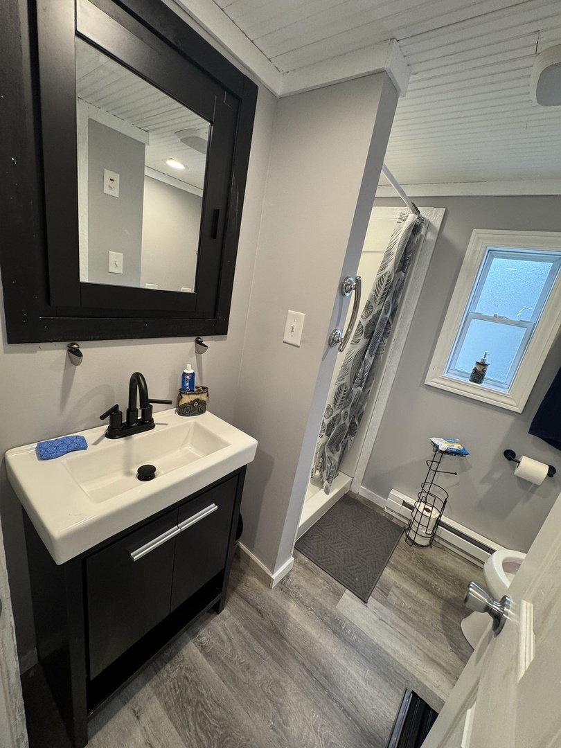 2-280 Woodhaven Sublette, IL 61367 - Photo 11 of 17 a bathroom with a sink mirror and vanity