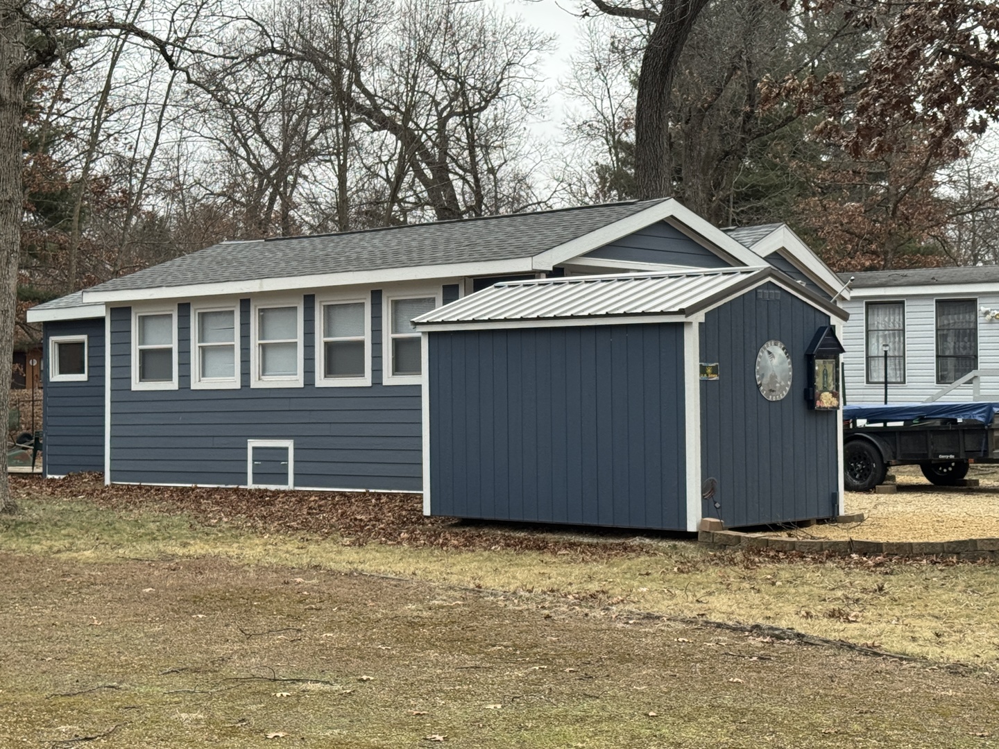 2-280 Woodhaven Sublette, IL 61367 - Photo 17 of 17 a house with trees in front of it