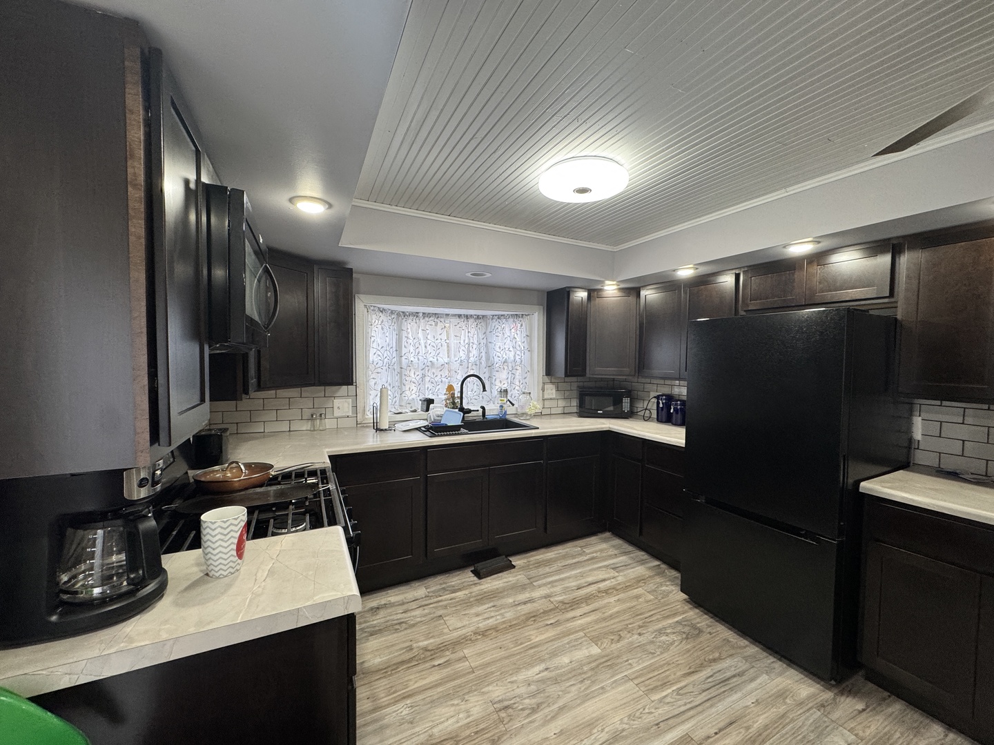 2-280 Woodhaven Sublette, IL 61367 - Photo 6 of 17 a kitchen with kitchen island granite countertop stainless steel appliances lots of counter top space