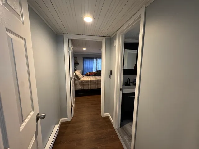 a bedroom with bed and a chandelier