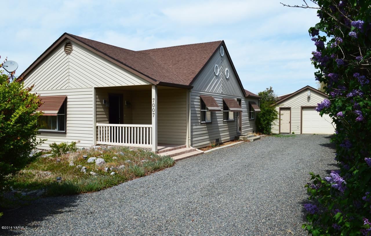 7007 Bell Road Yakima, WA 98901 - Photo 1 of 15 a view of a house with a yard
