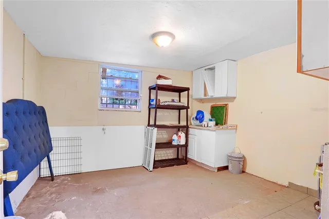 a room with furniture and white walls