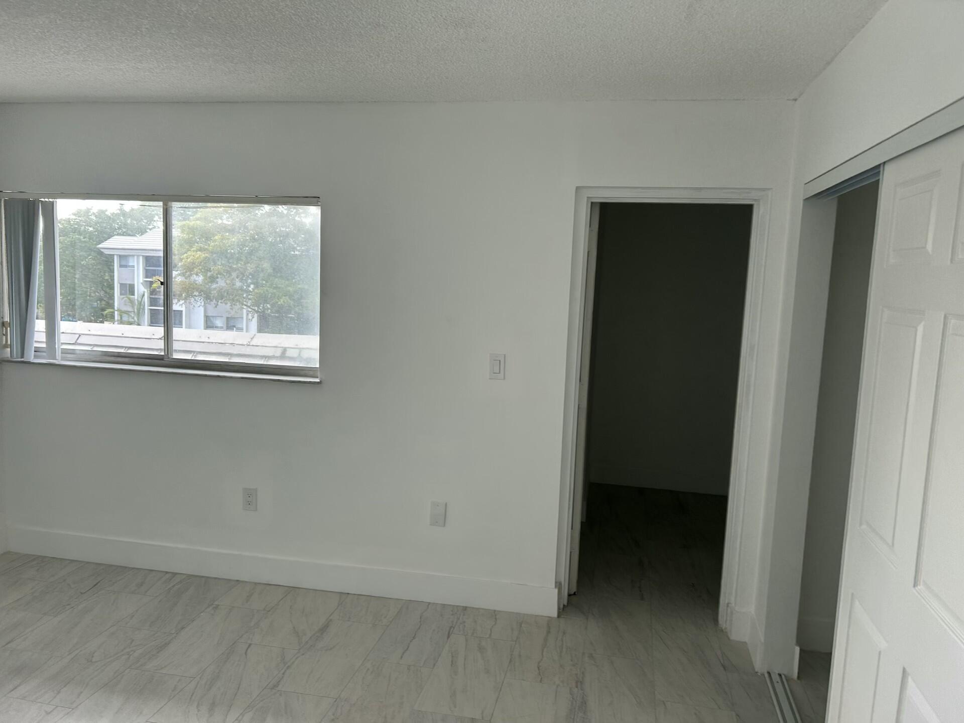 701 North Pine Island Road, Unit 304 Plantation, FL 33324 - Photo 20 of 77 a view of a small space with a window
