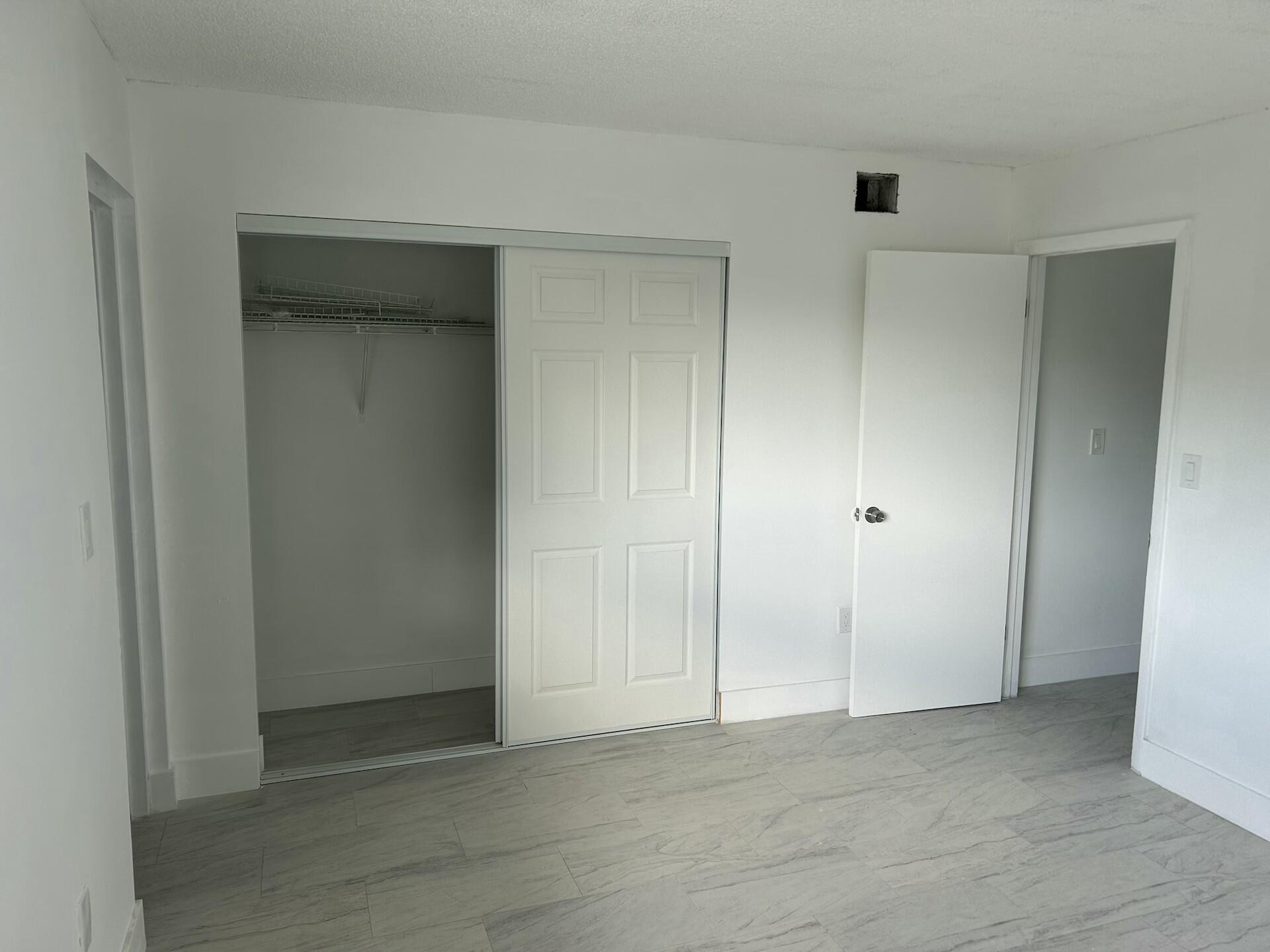 701 North Pine Island Road, Unit 304 Plantation, FL 33324 - Photo 21 of 77 an empty room with closet area