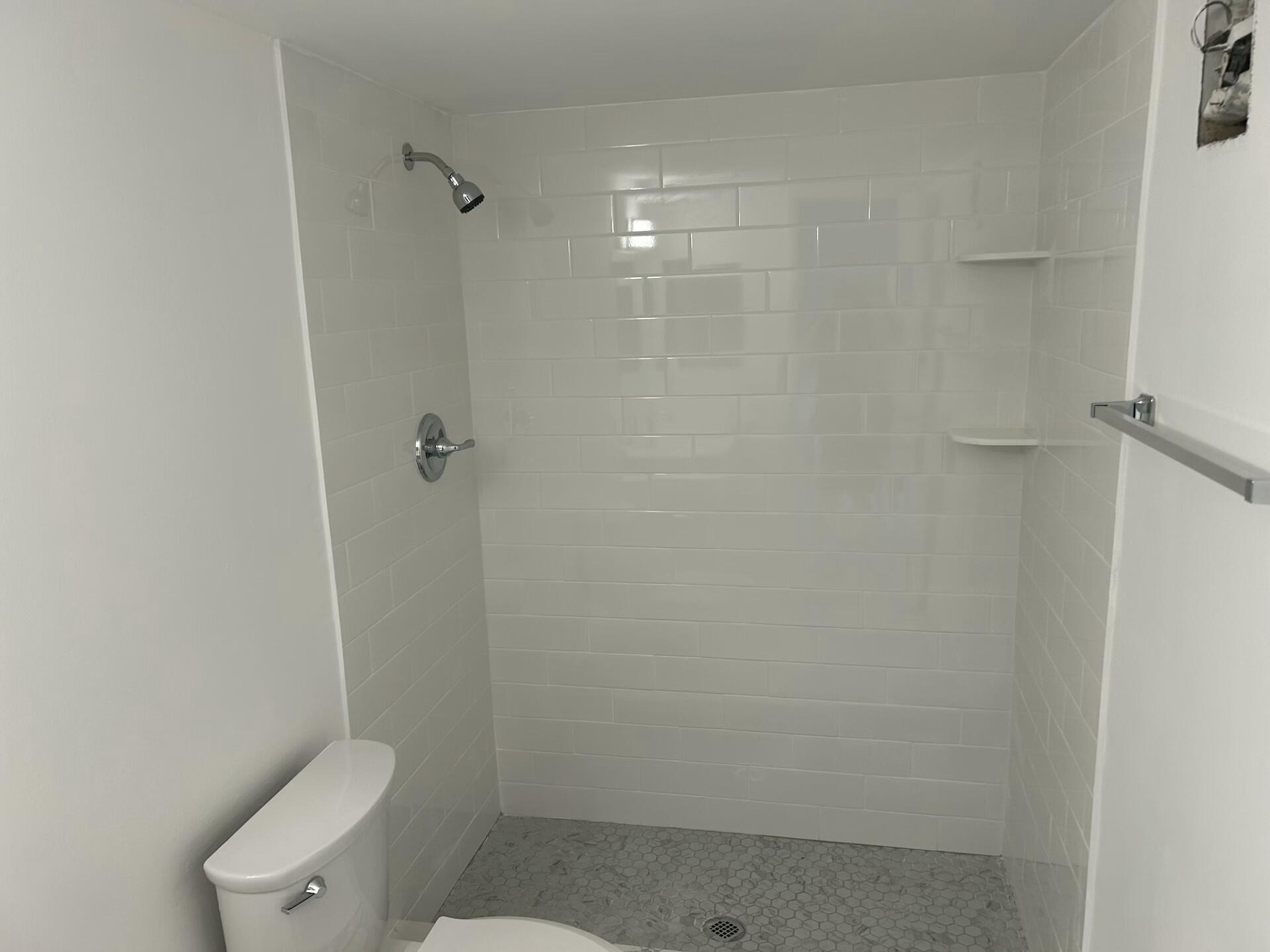 701 North Pine Island Road, Unit 304 Plantation, FL 33324 - Photo 28 of 77 a bathroom with a shower a toilet and sink