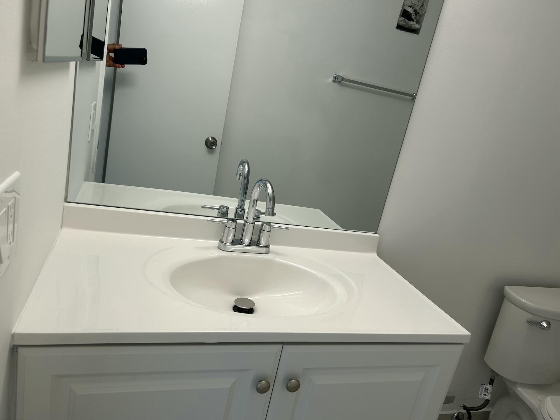 701 North Pine Island Road, Unit 304 Plantation, FL 33324 - Photo 31 of 77 a bathroom with a sink and a toilet