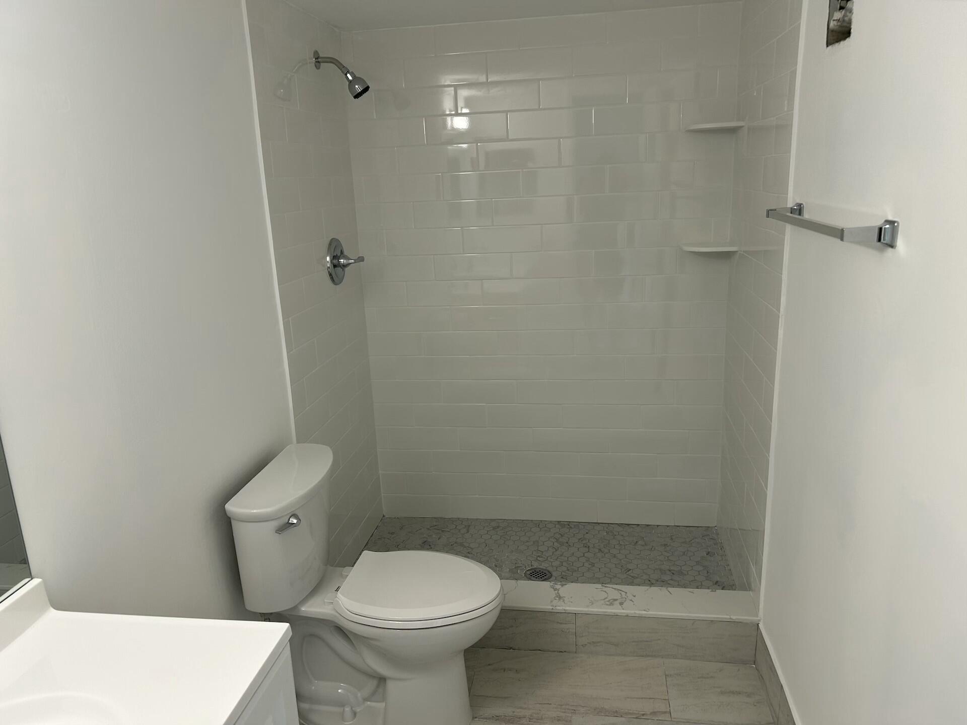 701 North Pine Island Road, Unit 304 Plantation, FL 33324 - Photo 32 of 77 a bathroom with a toilet and a shower