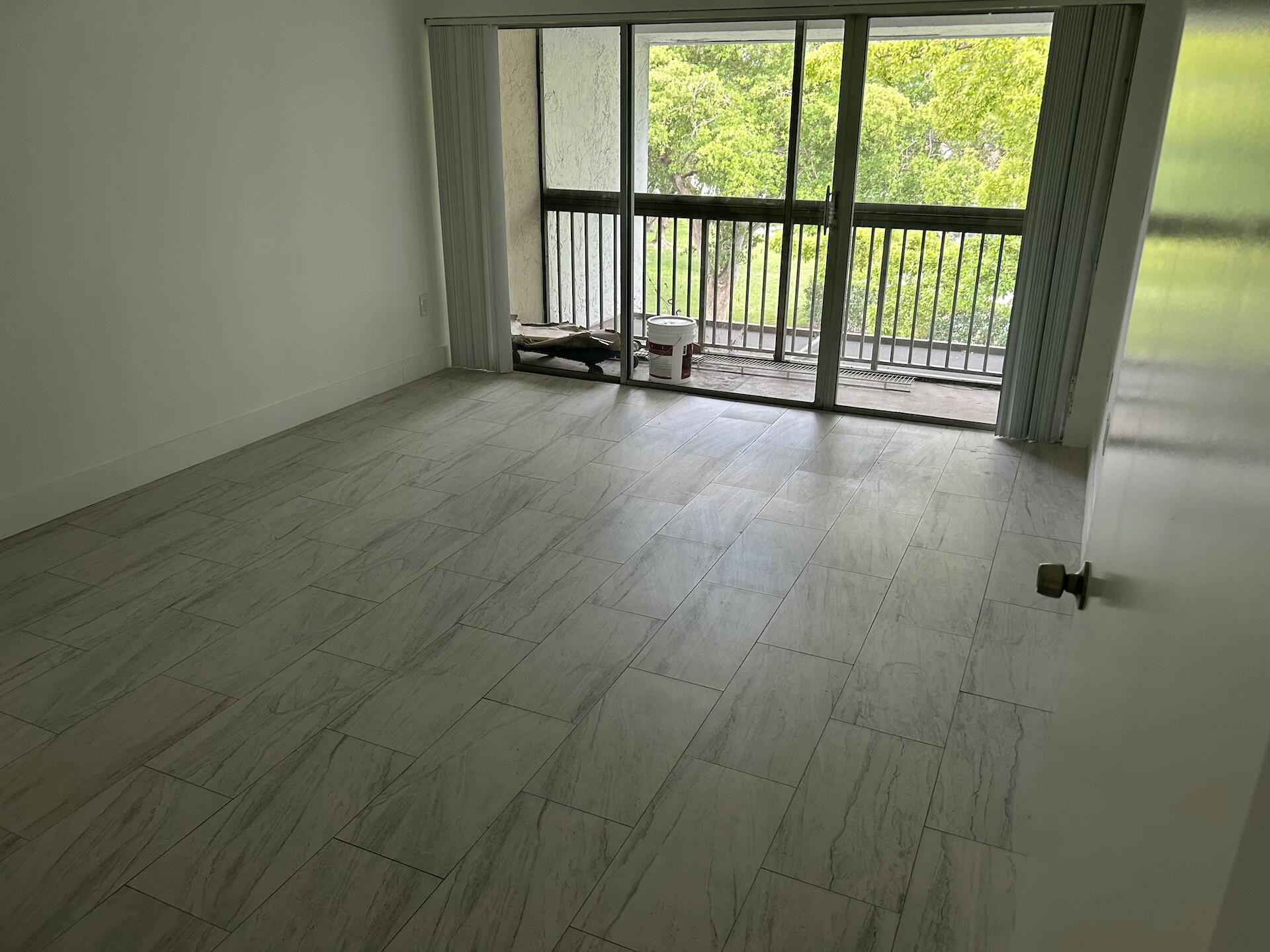 701 North Pine Island Road, Unit 304 Plantation, FL 33324 - Photo 33 of 77 a view of an empty room with a window