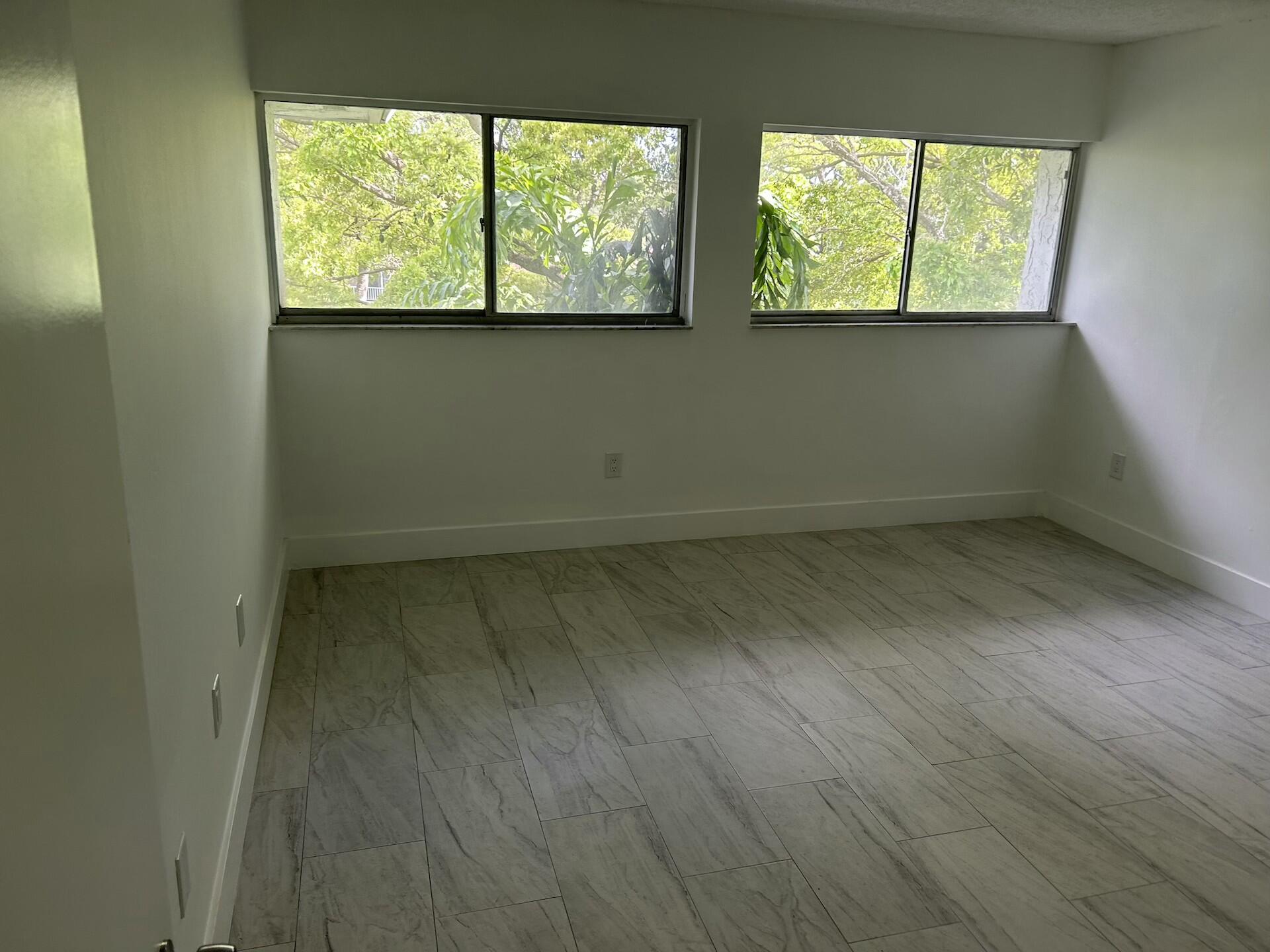 701 North Pine Island Road, Unit 304 Plantation, FL 33324 - Photo 51 of 77 an empty room with a window