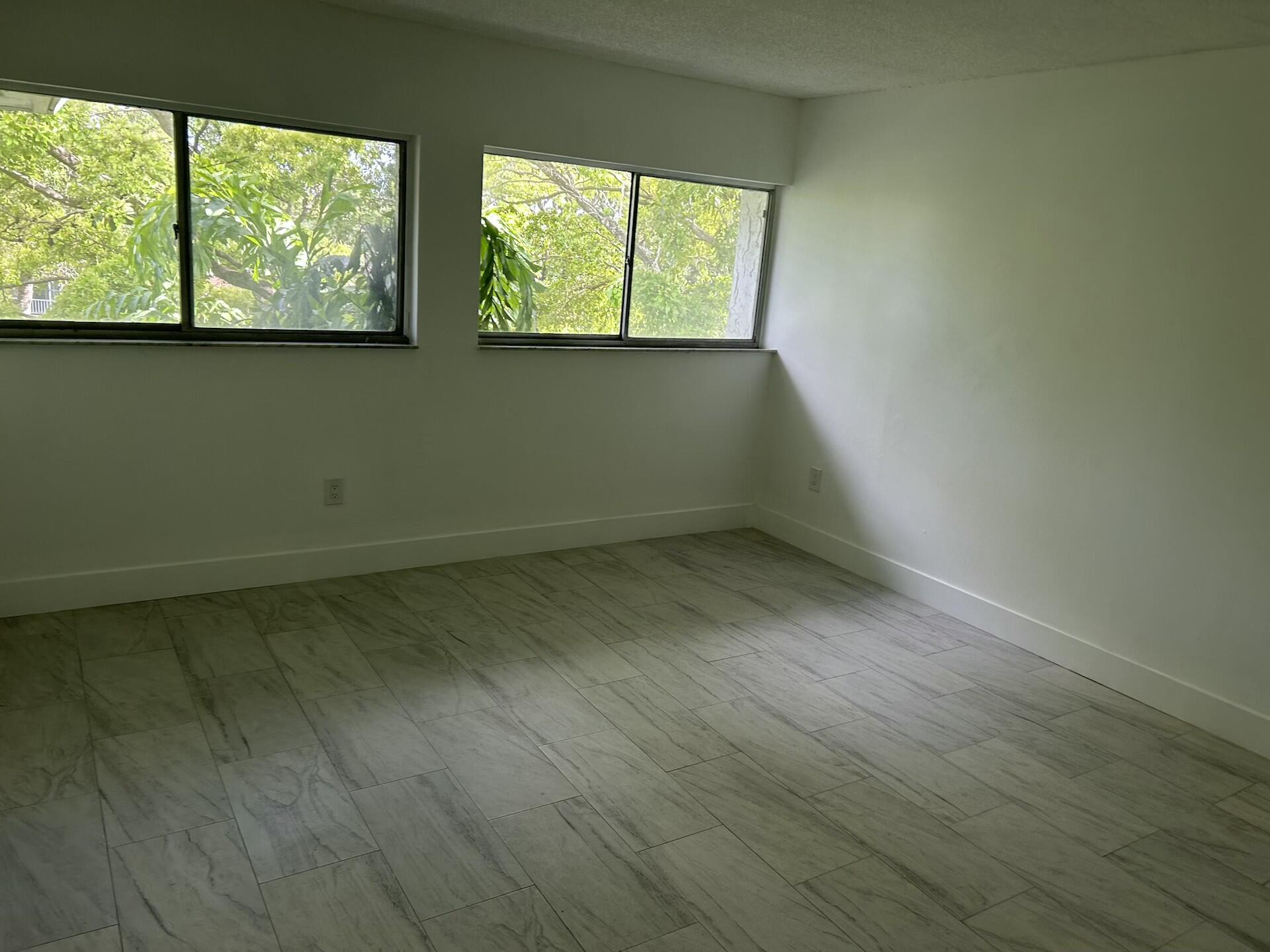 701 North Pine Island Road, Unit 304 Plantation, FL 33324 - Photo 52 of 77 an empty room with a window