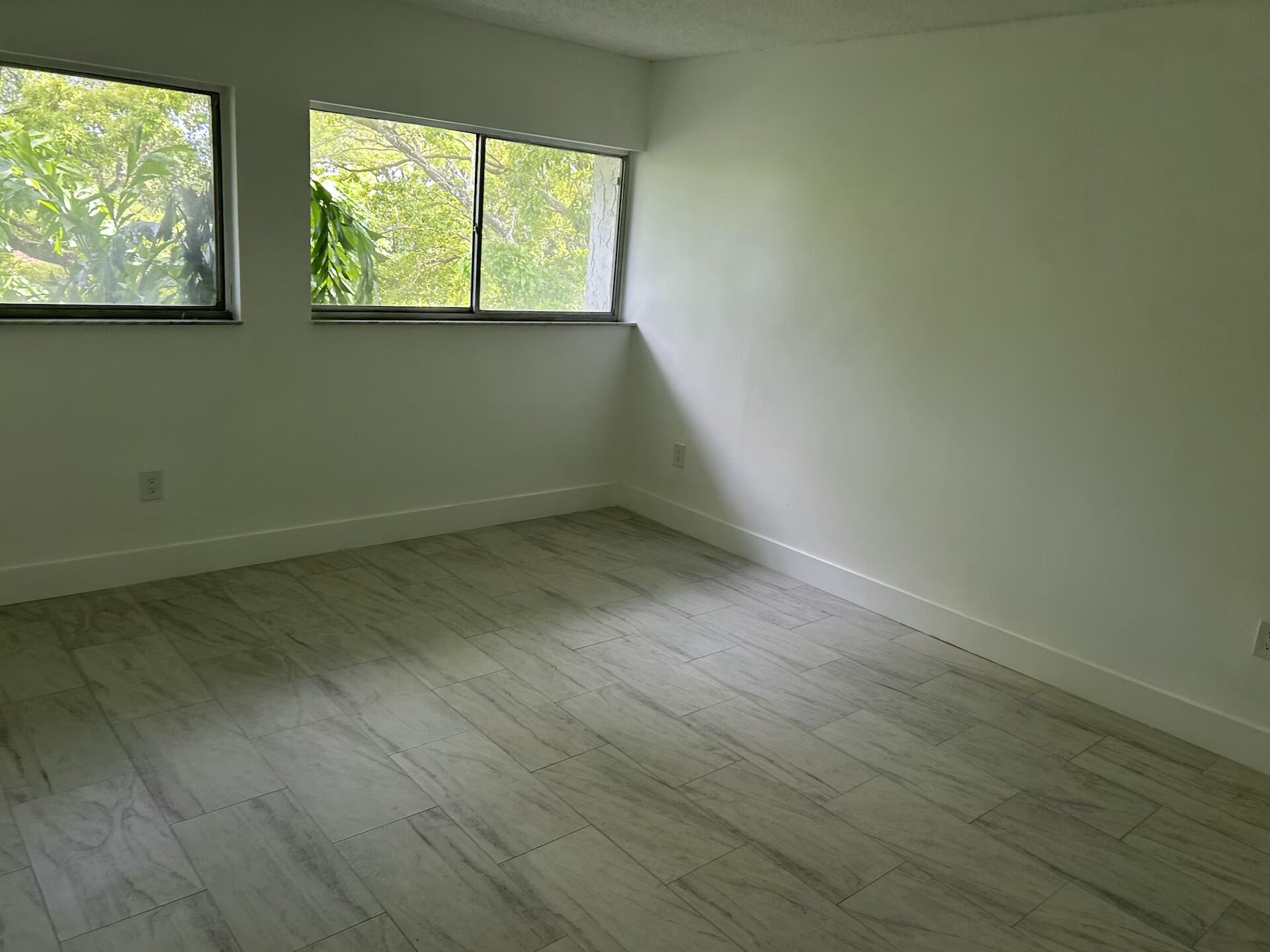 701 North Pine Island Road, Unit 304 Plantation, FL 33324 - Photo 53 of 77 an empty room with a window