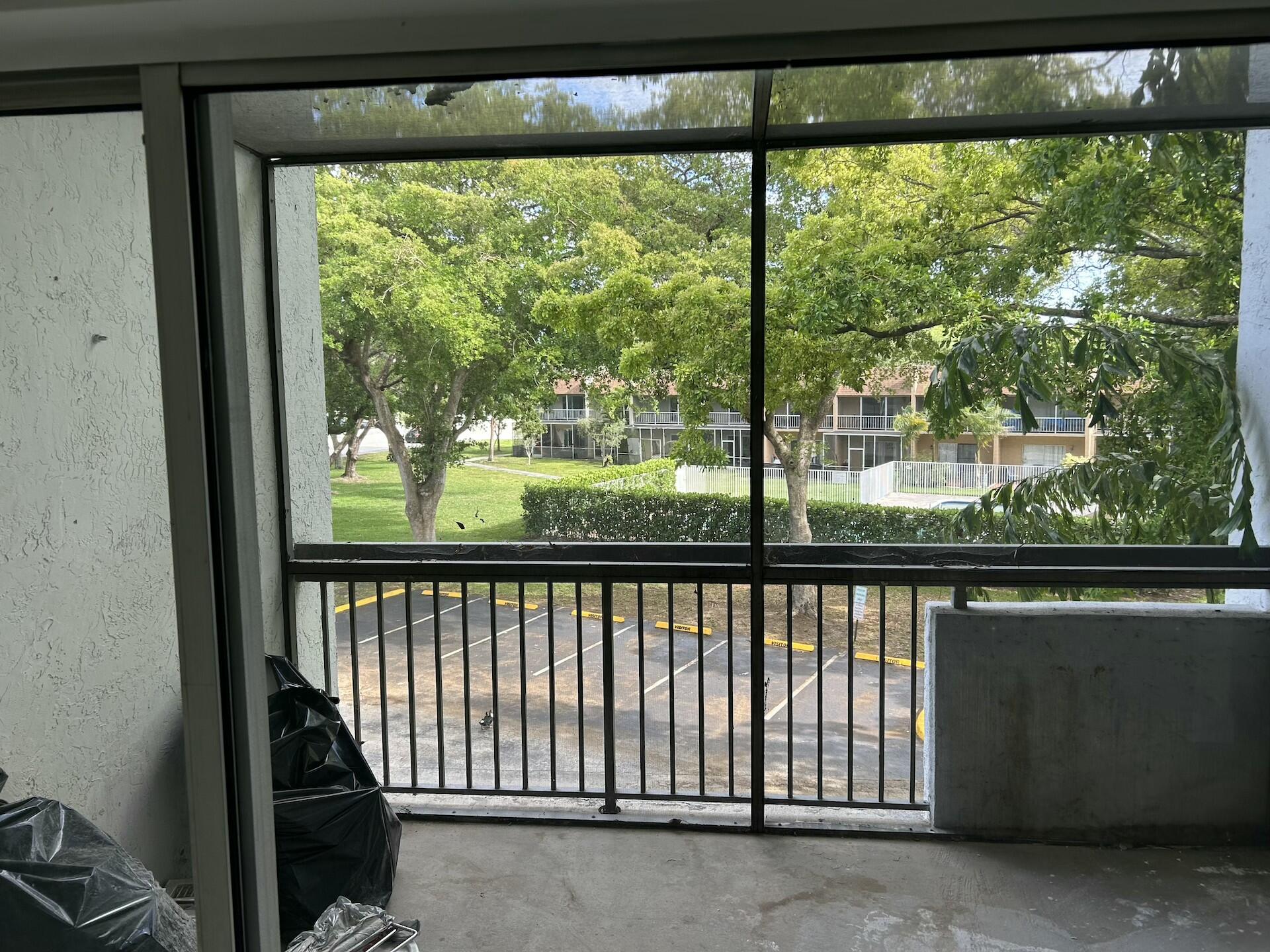 701 North Pine Island Road, Unit 304 Plantation, FL 33324 - Photo 65 of 77 a view of a balcony with a yard