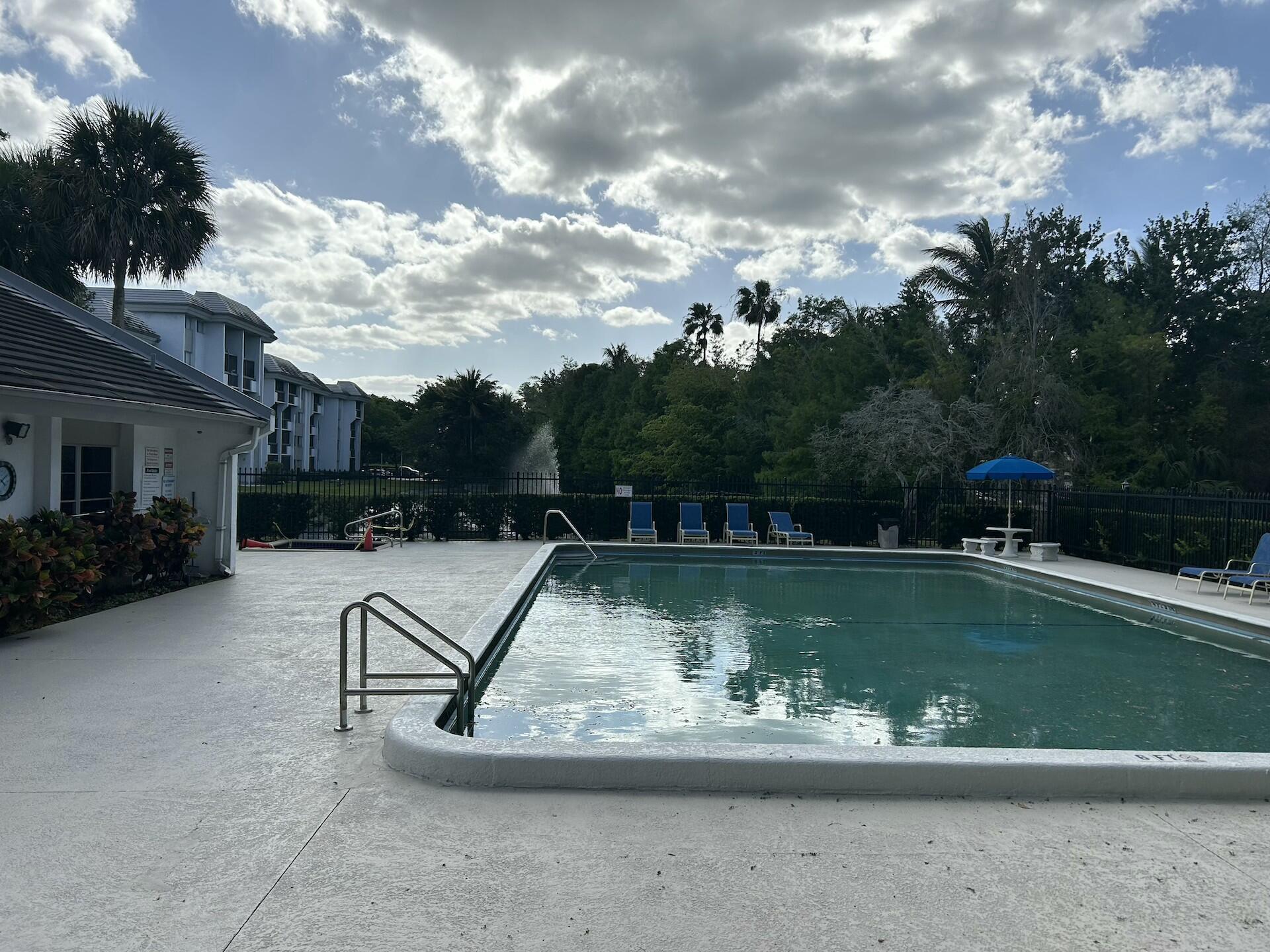 701 North Pine Island Road, Unit 304 Plantation, FL 33324 - Photo 70 of 77 a view of a swimming pool with a yard