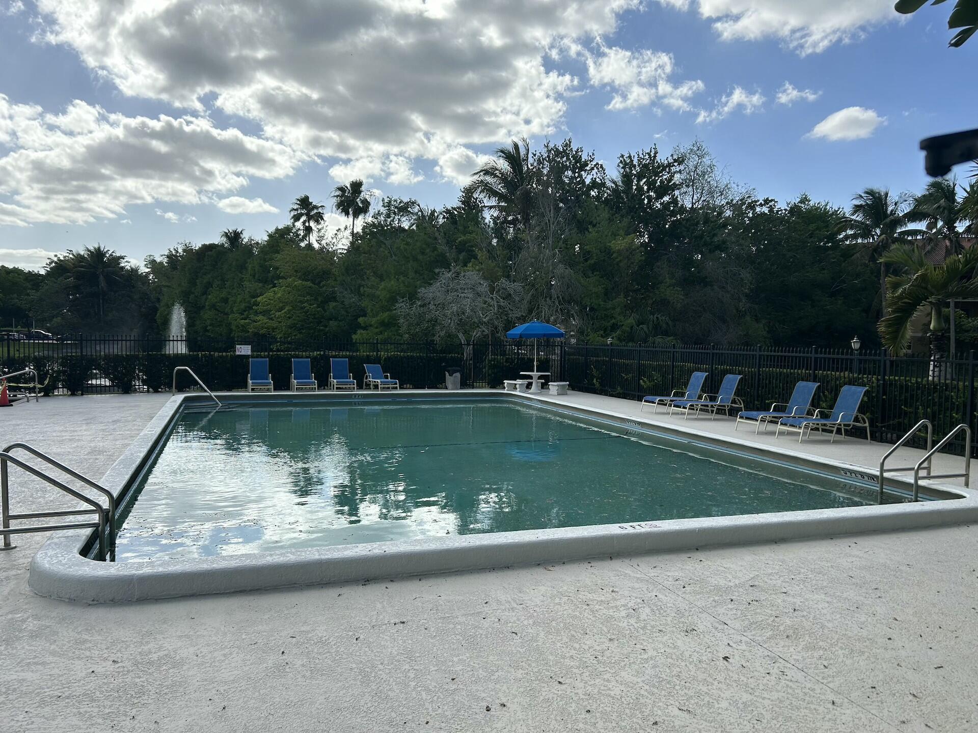 701 North Pine Island Road, Unit 304 Plantation, FL 33324 - Photo 73 of 77 a view of a swimming pool with a yard
