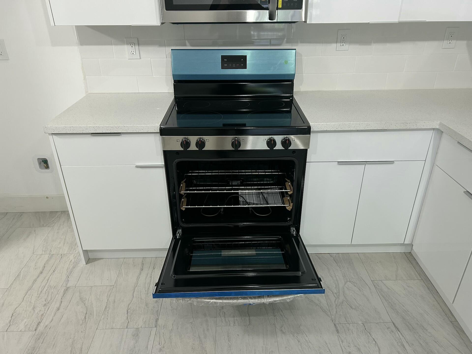 701 North Pine Island Road, Unit 304 Plantation, FL 33324 - Photo 8 of 77 a stove top oven sitting inside of a kitchen
