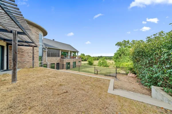 a house view with a backyard space