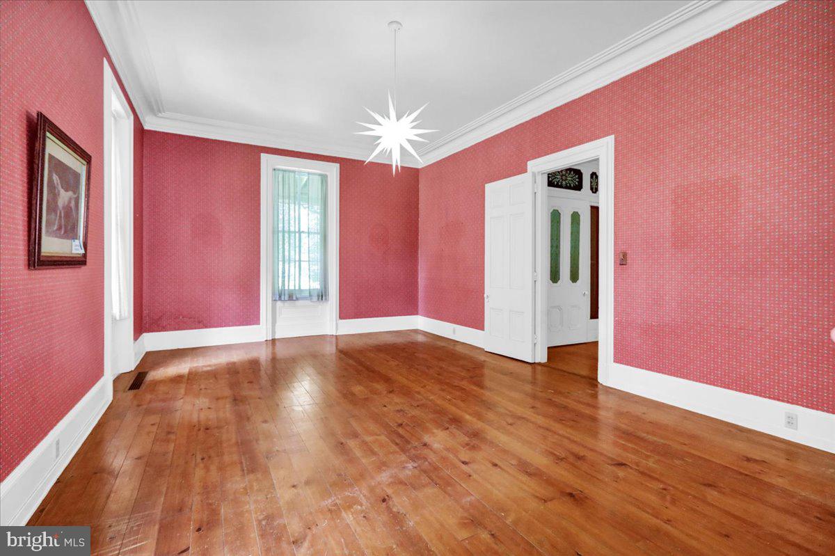 1670 Moselem Spring Road Hamburg, PA 19526 - Photo 22 of 78 a view of an empty room with window and wooden floor