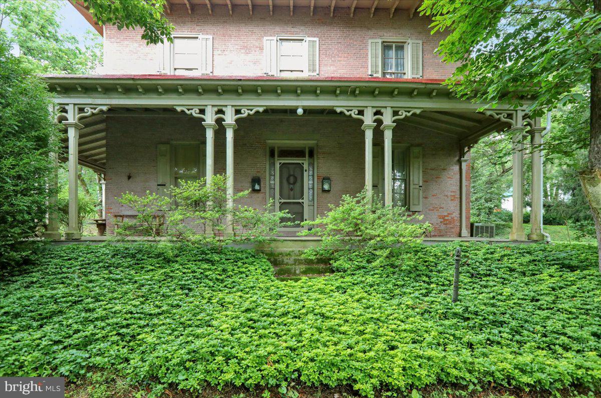 1670 Moselem Spring Road Hamburg, PA 19526 - Photo 37 of 78 front view of a house with a small yard