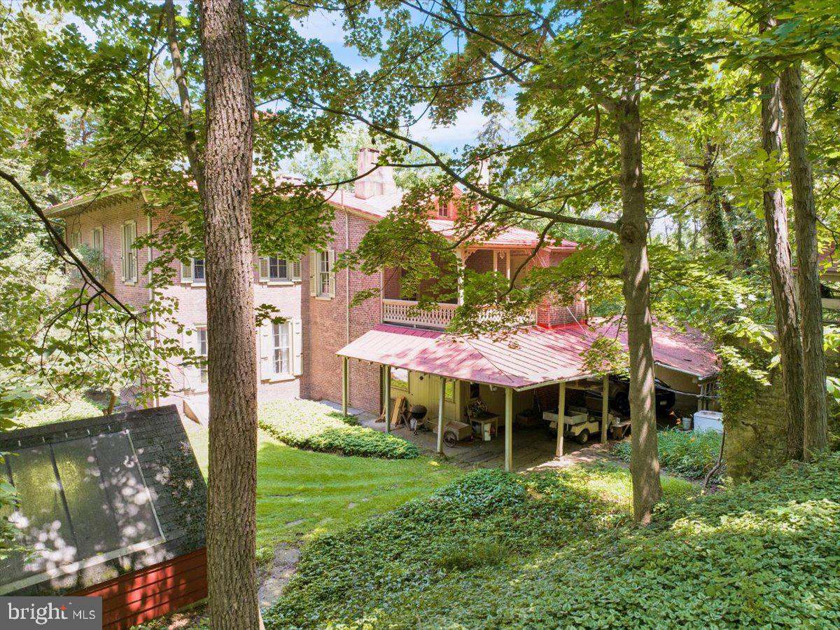 1670 Moselem Spring Road Hamburg, PA 19526 - Photo 63 of 78 a front view of a house with a yard table and chairs