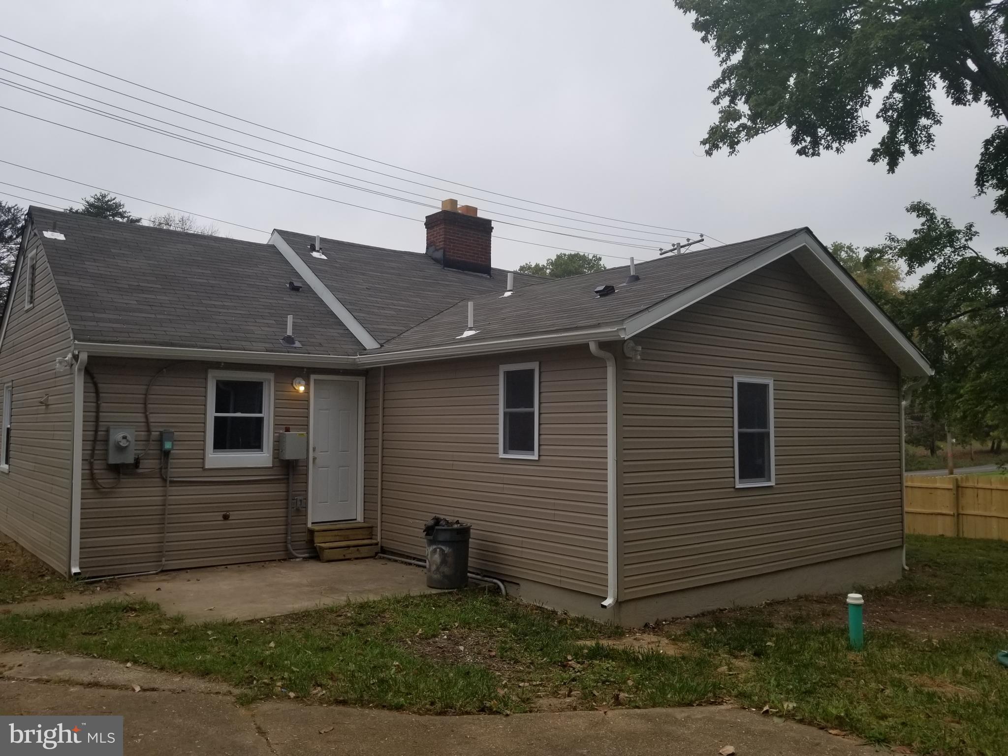 6828 Campfield Road Baltimore, MD 21207 - Photo 21 of 26 a front view of a house with garage