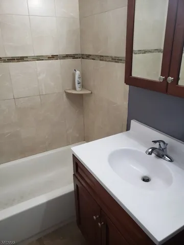 a bathroom with a sink and a bathtub