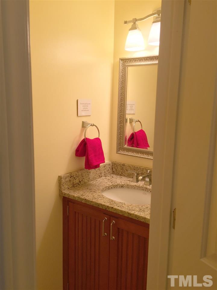 134 Timber Ridge Drive Durham, NC 27713 - Photo 15 of 25 Main floor powder room has Venetian Gold granite countertop and comfort height toilet.