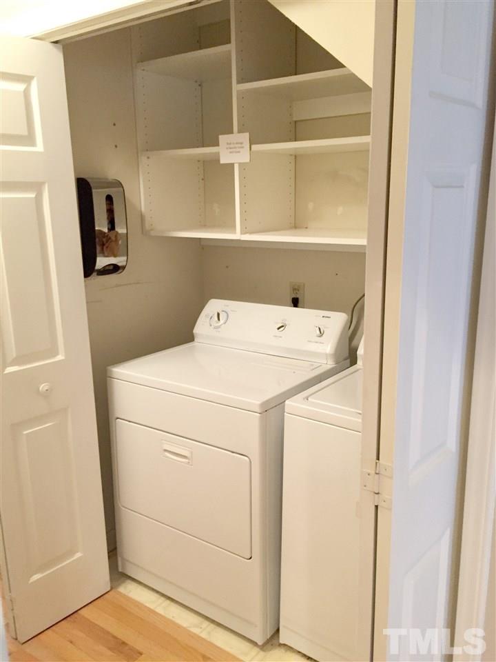 134 Timber Ridge Drive Durham, NC 27713 - Photo 16 of 25 Main floor laundry closet has built in shelving.