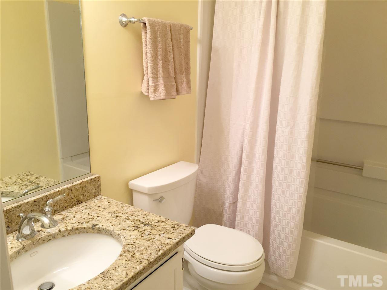 134 Timber Ridge Drive Durham, NC 27713 - Photo 25 of 25 Venetian Gold granite countertop dresses the guest bathroom.