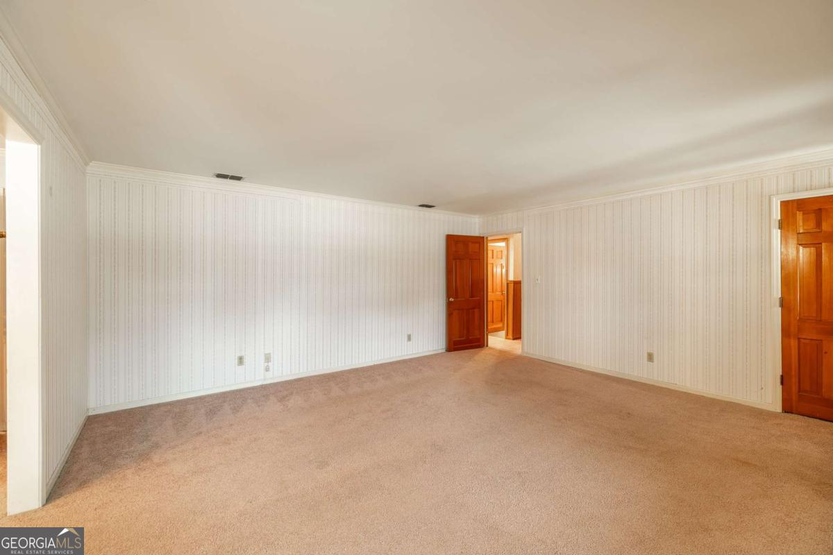 389 Ashton Drive Athens, GA 30606 - Photo 11 of 72 an empty room with an empty space and windows