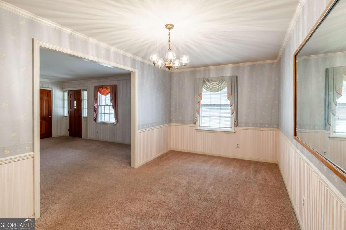 389 Ashton Drive Athens, GA 30606 - Photo 15 of 72 a view of an empty room with a window