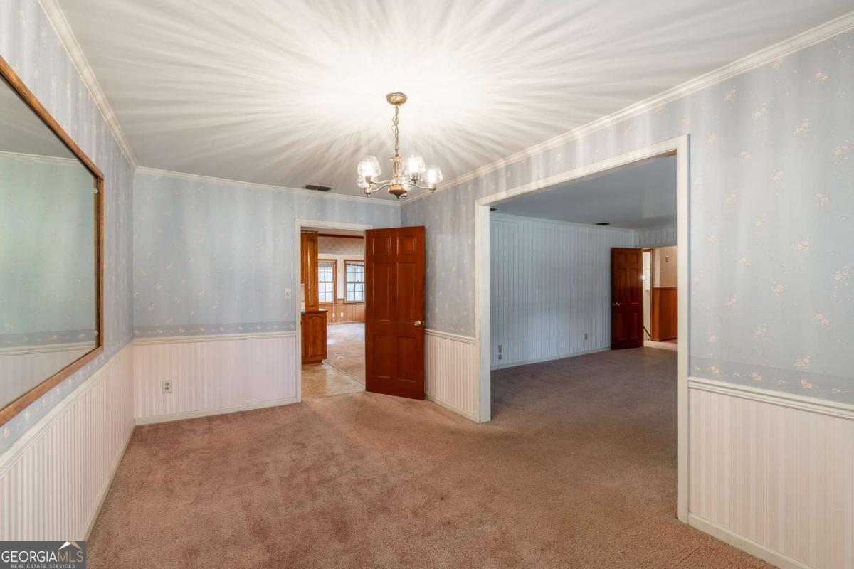 389 Ashton Drive Athens, GA 30606 - Photo 16 of 72 wooden floor in an empty room with a window